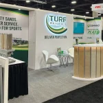Turf Materials' tradeshow booth attracts industry interest in a see of competition