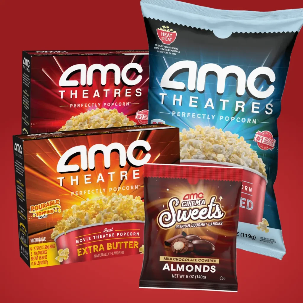 Various AMC branded retail packages including almond candies, ready to eat popcorn, and microwave popcorn.