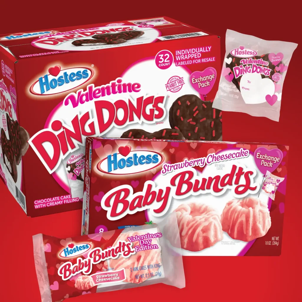 Various Hostess Valentines retail packages including Strawberry Cheesecake Baby Bundts and heart-shaped Ding Dongs.